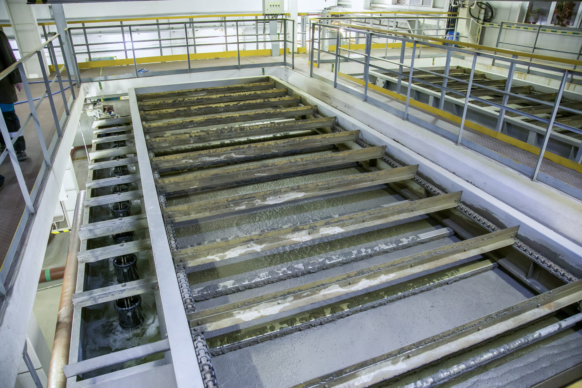 Industrial liquid-treatment tank system photographed from above