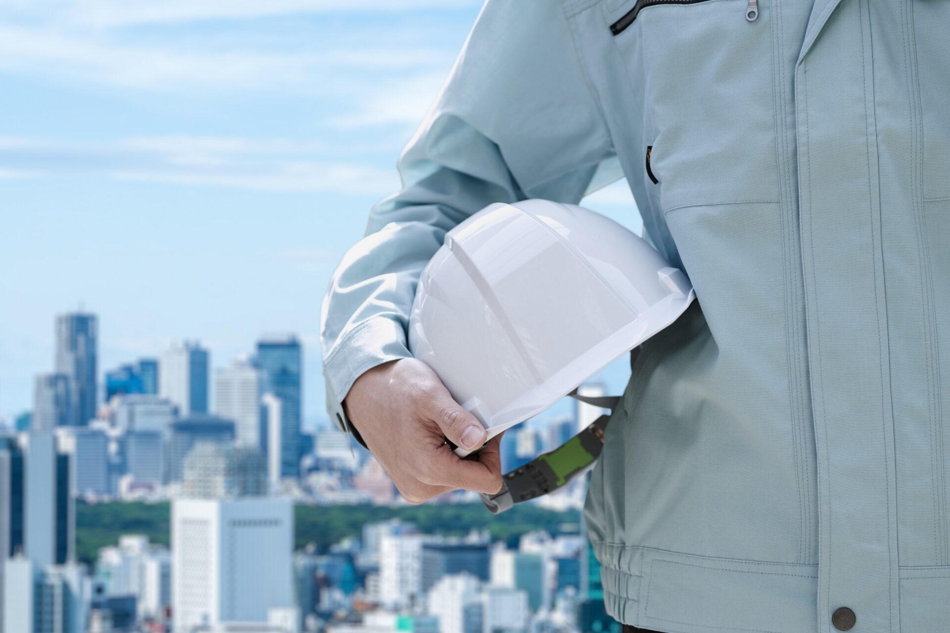 Worker holding a helmet, illustrating sweat control use in industrial settings
