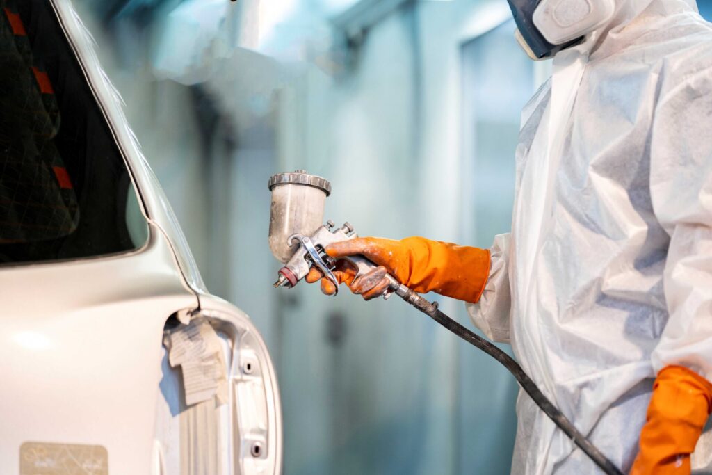 Operator working in the automotive pre-painting process